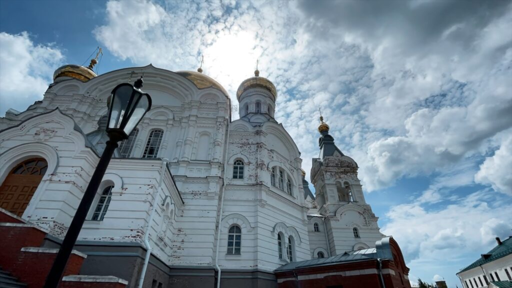 A huge Orthodox church. Clip. A beautiful large white church with golden domes and a beautiful clean